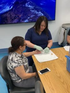 Staff providing hand therapy