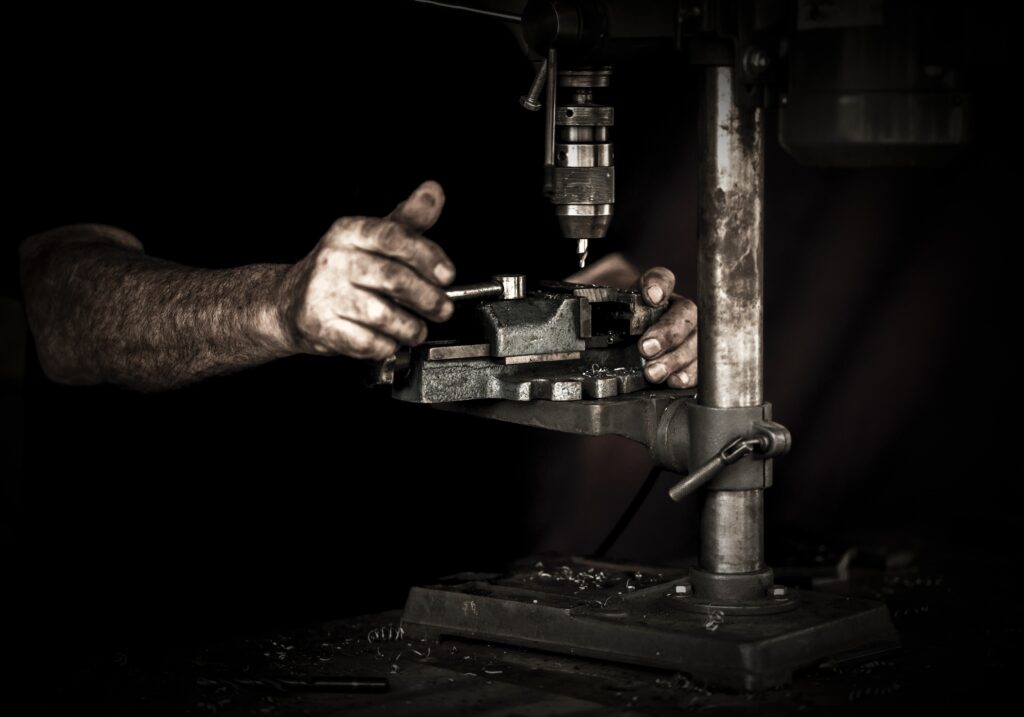 Hands working in a shop.